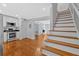 Modern open kitchen featuring stainless steel appliances, white cabinets, hardwood floors, and open floorplan at 1261 Lavista Ne Rd # E-8, Atlanta, GA 30324