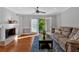 Cozy living room with a fireplace and sliding glass doors to the exterior at 1261 Lavista Ne Rd # E-8, Atlanta, GA 30324