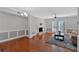 Spacious living room with hardwood floors, fireplace, and sliding door to outdoor space at 1261 Lavista Ne Rd # E-8, Atlanta, GA 30324