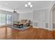 Open living room featuring hardwood floors, stylish ceiling fan, and access to the outdoors at 1261 Lavista Ne Rd # E-8, Atlanta, GA 30324