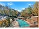 Inviting community pool area with lounge chairs surrounded by lush landscaping and a secure fence at 1261 Lavista Ne Rd # E-8, Atlanta, GA 30324