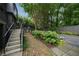 Beautifully landscaped backyard with stone steps and mature plantings at 1860 Anjaco Nw Rd, Atlanta, GA 30309