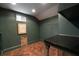 Finished basement space featuring brick flooring and custom wall details at 1860 Anjaco Nw Rd, Atlanta, GA 30309