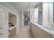 Bathroom with dual sinks, marble countertops, and custom cabinets at 1860 Anjaco Nw Rd, Atlanta, GA 30309