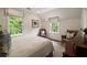 Bright bedroom with large windows, charming sitting area, and natural light at 1860 Anjaco Nw Rd, Atlanta, GA 30309