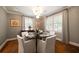 Dining room features a round table, elegant chairs, and decorative lighting at 1860 Anjaco Nw Rd, Atlanta, GA 30309