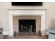 Close-up of a classic fireplace with a white mantel and decorative brass fire screen at 1860 Anjaco Nw Rd, Atlanta, GA 30309