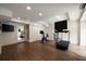 Well-lit home gym featuring a mirrored wall and state of the art exercise equipment at 1860 Anjaco Nw Rd, Atlanta, GA 30309