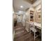 Hallway with hardwood floors leads to an office nook and entry door at 1860 Anjaco Nw Rd, Atlanta, GA 30309