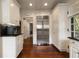 Bright kitchen with white cabinetry, stainless steel appliances, and hardwood floors at 1860 Anjaco Nw Rd, Atlanta, GA 30309