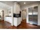 Spacious kitchen with white cabinets, hardwood floors, and stainless steel refrigerator at 1860 Anjaco Nw Rd, Atlanta, GA 30309