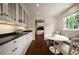 Bright kitchen nook with built-in seating, a round table, and ample natural light at 1860 Anjaco Nw Rd, Atlanta, GA 30309