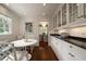 Kitchen nook with natural light, a built-in bench, and access to the formal dining area at 1860 Anjaco Nw Rd, Atlanta, GA 30309