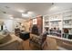 Inviting living area featuring a fireplace, built-in shelving, and comfortable seating at 1860 Anjaco Nw Rd, Atlanta, GA 30309