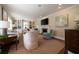 Spacious living room features a fireplace, built-in shelving, and multiple seating areas at 1860 Anjaco Nw Rd, Atlanta, GA 30309