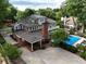 Stunning aerial view of the home showcasing the pool, patio, and lush landscaping at 1036 Oxford Ne Rd, Atlanta, GA 30306