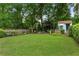 This backyard features a large grassy area and shed at 1036 Oxford Ne Rd, Atlanta, GA 30306