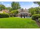 Spacious backyard features a pool, well-maintained lawn, and mature landscaping at 1036 Oxford Ne Rd, Atlanta, GA 30306