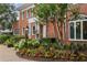 Inviting front yard with blooming flowers, manicured shrubbery, and a classic lamp post enhancing curb appeal at 1036 Oxford Ne Rd, Atlanta, GA 30306
