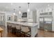 Bright kitchen with a marble top island, barstool seating, stainless steel appliances, and ample cabinet space at 1036 Oxford Ne Rd, Atlanta, GA 30306