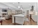 Open concept kitchen and living room with stone fireplace, hardwood floors, and plenty of natural light at 1036 Oxford Ne Rd, Atlanta, GA 30306