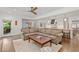 Spacious open-concept living area with a fireplace, hardwood floors, and direct access to both the kitchen and backyard at 1036 Oxford Ne Rd, Atlanta, GA 30306
