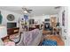 Bright open-concept living room with a kitchen view, eclectic decor, and hardwood floors at 1036 Oxford Ne Rd, Atlanta, GA 30306