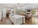 Open floor plan with kitchen island, living room with fireplace, and backyard access, offering seamless indoor-outdoor living at 1036 Oxford Ne Rd, Atlanta, GA 30306