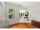 Bright office with hardwood floors and sunroom featuring a glass ceiling and many windows at 1036 Oxford Ne Rd, Atlanta, GA 30306