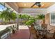 Inviting outdoor patio features a ceiling fan, brick flooring, and lush landscaping at 1036 Oxford Ne Rd, Atlanta, GA 30306