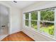 This sun room has hardwood floors and a large window with a view of the backyard at 1036 Oxford Ne Rd, Atlanta, GA 30306