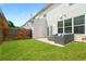 Well-maintained backyard features a patio, a seating area, and a lush lawn at 125 Flatwood, Marietta, GA 30066