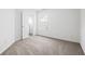 Bright bedroom with neutral carpet and fresh white walls, providing a calming space at 125 Flatwood, Marietta, GA 30066