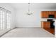 Bright dining area with light-colored walls, chandelier, and access to the outdoor space at 125 Flatwood, Marietta, GA 30066
