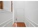 Bright foyer with white walls, hardwood floors, staircase, and wainscoting at 125 Flatwood, Marietta, GA 30066