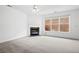 Bright, spacious living room with large windows and a cozy fireplace focal point at 125 Flatwood, Marietta, GA 30066