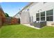 Grassy backyard with a patio area perfect for outdoor seating and relaxation at 125 Flatwood Trail, Marietta, GA 30066
