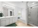 A well-lit bathroom with a built in bathtub and shower and modern fixtures at 125 Flatwood Trail, Marietta, GA 30066