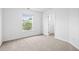 A spacious bedroom featuring a large window and modern interior paint at 125 Flatwood Trail, Marietta, GA 30066