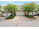 Inviting townhome featuring well-manicured landscaping, a private garage, and charming curb appeal at 125 Flatwood Trail, Marietta, GA 30066