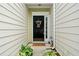 Charming front entrance featuring a black door, decorative wreath, and a 'Welcome' mat at 125 Flatwood Trail, Marietta, GA 30066