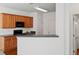 Modern kitchen featuring wooden cabinetry, appliances, and wood flooring at 125 Flatwood Trail, Marietta, GA 30066