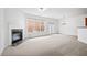 Spacious living room featuring a fireplace, chandelier, and ample natural light, ready for personalization at 125 Flatwood Trail, Marietta, GA 30066