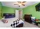 Colorful bedroom with carpet, ceiling fan, and functional furniture, creating a comfortable space at 192 Sandhurst Ct, Suwanee, GA 30024