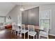 Dining area featuring high ceilings, modern lighting, and a stylish accent wall at 192 Sandhurst Ct, Suwanee, GA 30024