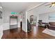 Inviting living room with hardwood floors, neutral wall color, and an open floorplan at 192 Sandhurst Ct, Suwanee, GA 30024