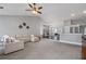 Open concept living room showcases vaulted ceilings, modern decor, and seamless flow to the dining area at 192 Sandhurst Ct, Suwanee, GA 30024