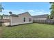 Fenced backyard featuring a lush lawn and mature trees at 2022 Patterson Park Dr, Lawrenceville, GA 30044