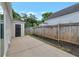 Backyard patio with partial privacy fence and storage shed at 2022 Patterson Park Dr, Lawrenceville, GA 30044