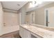 Bright bathroom with granite counters, single sink, tub, and shower combo at 2022 Patterson Park Dr, Lawrenceville, GA 30044